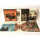 Seven LPs from the 1960s by various artists including The Hollies, The Kinks, The Beach Boys and