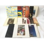 A collection of Rock LPs by various artists including Pink Floyd, Led Zeppelin. The Clash, Van