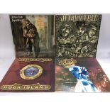 Four Jethro Tull LPs comprising 'Stand Up', 'Aqualung', 'War Child' and 'Rock Island'.