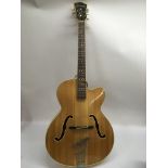 A Hofner President archtop guitar supplied with a hard carry case, tortoiseshell pickguard, Selmer