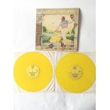 A yellow vinyl pressing of the 'Goodbye Yellow Brick Road' double LP by Elton John.