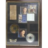 A framed and glazed limited edition multi CD display of Bob Marley, approx 54.5cm x 69.5cm.