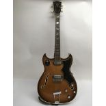 An unusual 1960s Vox hollow body electric guitar, similar in style to the Crucianelli model, with
