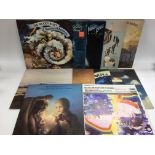 A collection of Moody Blues and related LPs.