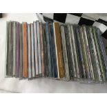 A bag of approx 80 plus CD singles by various artists including including Elton John, U2, Paul
