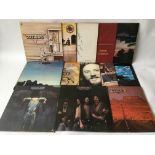 A collection of Southern Rock LPs by various artists including Jackson Browne, Eagles, Poco and