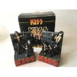 A boxed collectable pair of Kiss bookends, made of resin and depicting the group in 'rock' poses,