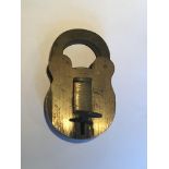 A Solid brass Vintage padlock four lever mechanism with side ward key stamped ref 6/321 12x7.5cm,