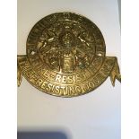 A brass Millers Safe makers plaque of circular shape. Diameter 25cm