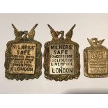 Three cast brass antique graduating size key escutcheon plates with sliding key covers powder proof.