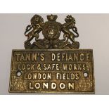 An Antique brass safe makers plaque maker Tanns Defiance London the plaque with Royal Crest.