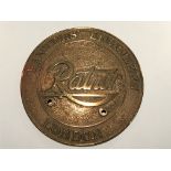 A cast bronze safe circular plaque maker Ratner of London. 15cm diameter.