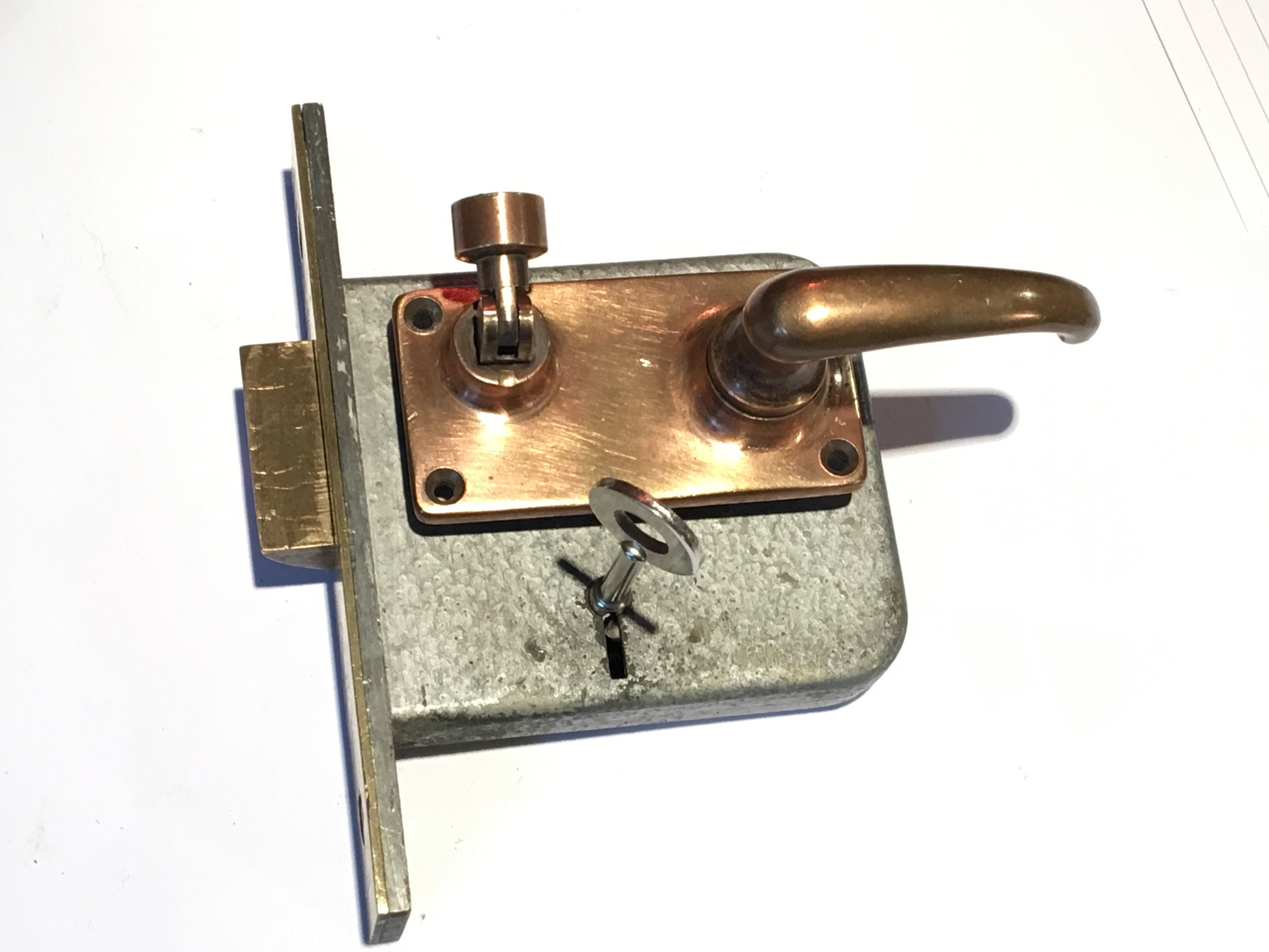 A 1950s Chubb Mortice night latch with bronze furniture and key 8.5cm x 13cm