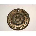 A cast brass key escutcheon plate of circular shape maker Hobbs &Co