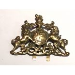 An Antique cast brass safe door crest.