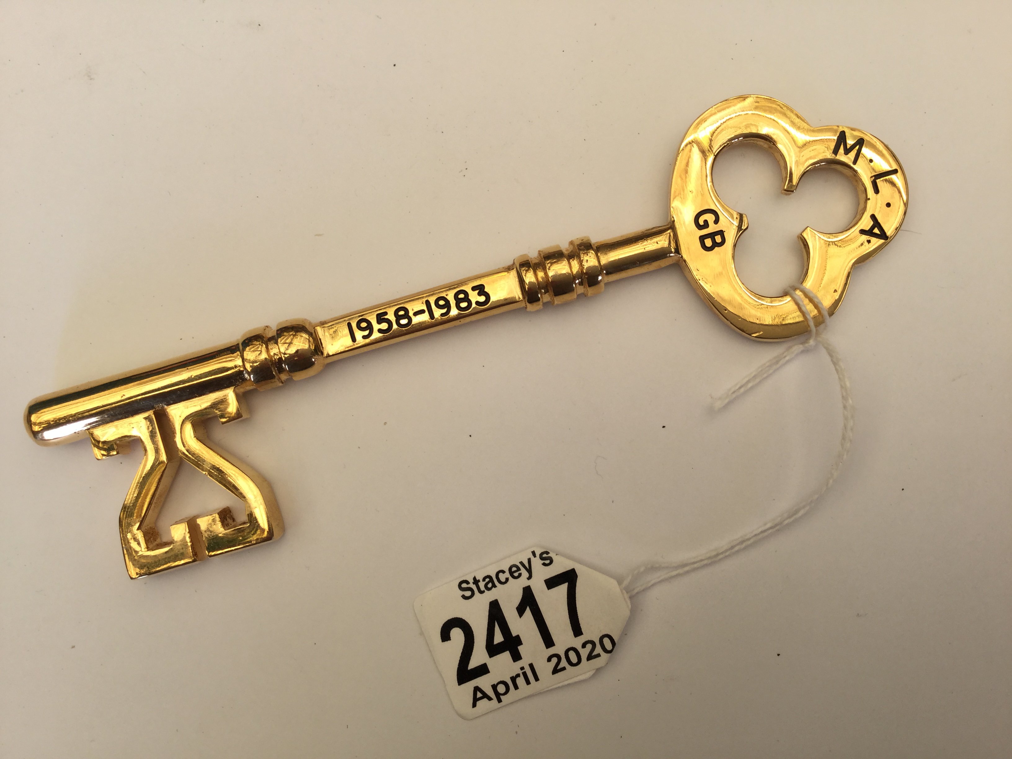 A solid brass commemorative key M.L.A GB 1958-1983. Length 17cm, one of a limited edition