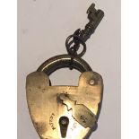 A Victorian brass padlock with a key 6.5cm.