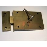 A vintage Chubb rim lock with brass strike box and two keys. 15x9cm