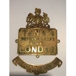 An Antique brass safe makers plaque Tanns London with a secondary plaque (2)