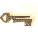 A Novelty brass Victorian butlers key with retractable knife, bottle opener. 13.5cm long.