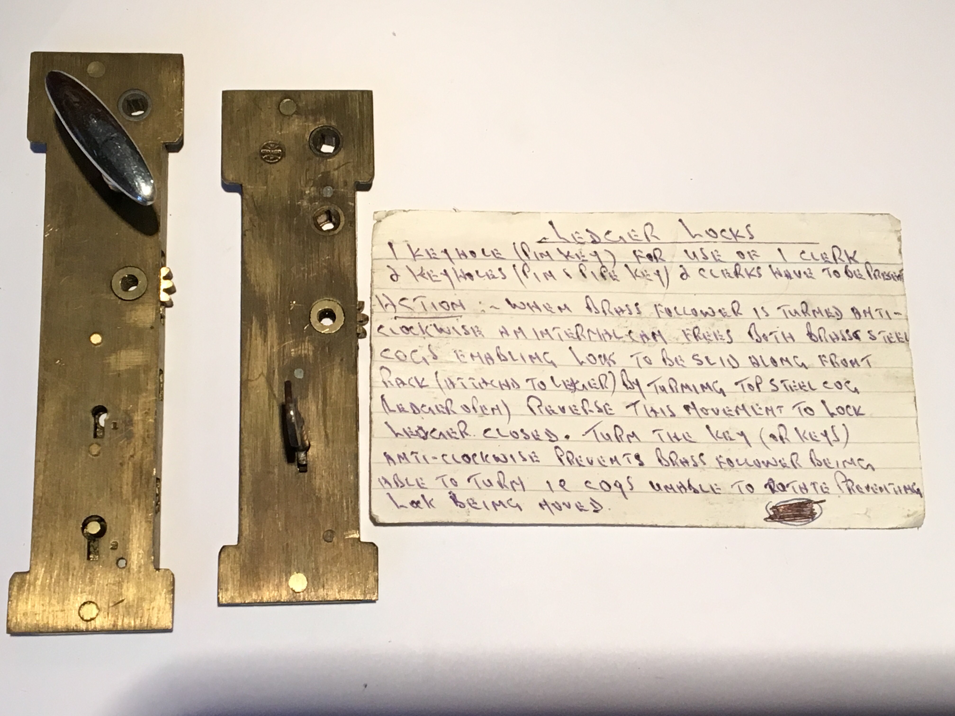 Two rare 19th Century brass ledger book locks with handwritten operation notes with one key. - Image 2 of 2