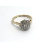 A 9carat gold ring set with a pattern of diamonds