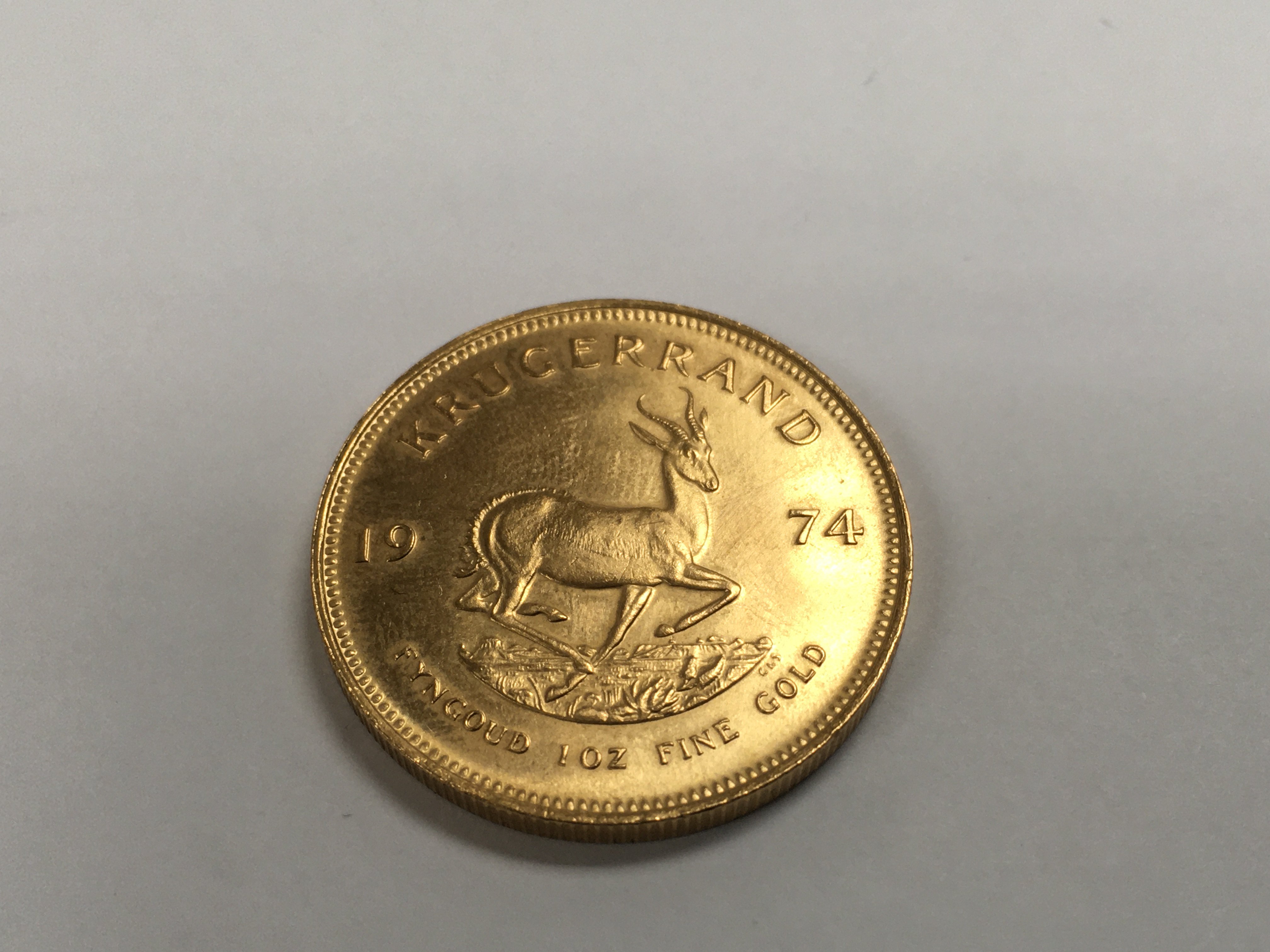A 1974 1 oz gold krugerrand.