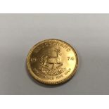 A 1974 1 oz gold krugerrand.