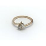 A 9ct gold two stone diamond ring, approx .30ct, a