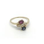 A 14 carat gold ring set with ruby and sapphire wi