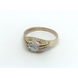 A gents 9ct gold gypsy ring set with a small diamo