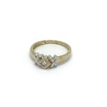 A 9carat ring set with diamonds. Ring size M.