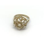 A 9carat gold ring set with a pattern of cultured