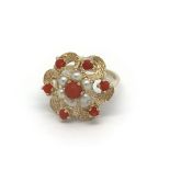 A 9carat gold ring set with a pattern of coral and