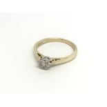 A 9carat gold ring set with a brilliant cut diamon