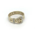A gents 9ct gold diamond set buckle ring, (R), 3.7