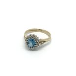 A 9carat gold ring set with a blue topaz and small