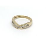 18ct gold 9 diamond wishbone ring, (O), 3.8g.