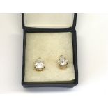 A pair of pear drop stone earrings set in 14ct gol