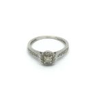 A 9carat white gold ring set with diamonds and wit