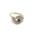 A 14ct cabochon ruby and diamond ring, (Q), 4.2g.