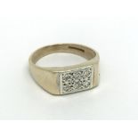 A Gents ring set with a pattern of diamonds ring s