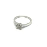 An 18 carat white gold ring set with a round patte