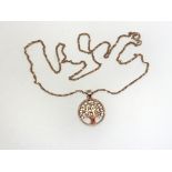 A silver and rose gold gilt tree of life necklace