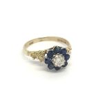 A 9carat gold ring set with a pattern of sapphire