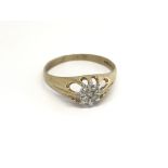 A Gents 9carat gold ring set with a pattern of dia