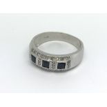 A 9ct white gold sapphire and diamond ring (S), 4.