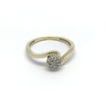 A 9carat gold ring set with a pattern of diamonds