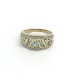 A 9ct gold, diamond and topaz ring, (O), 3.6g