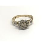 A 9carat gold ring set with a pattern of diamonds